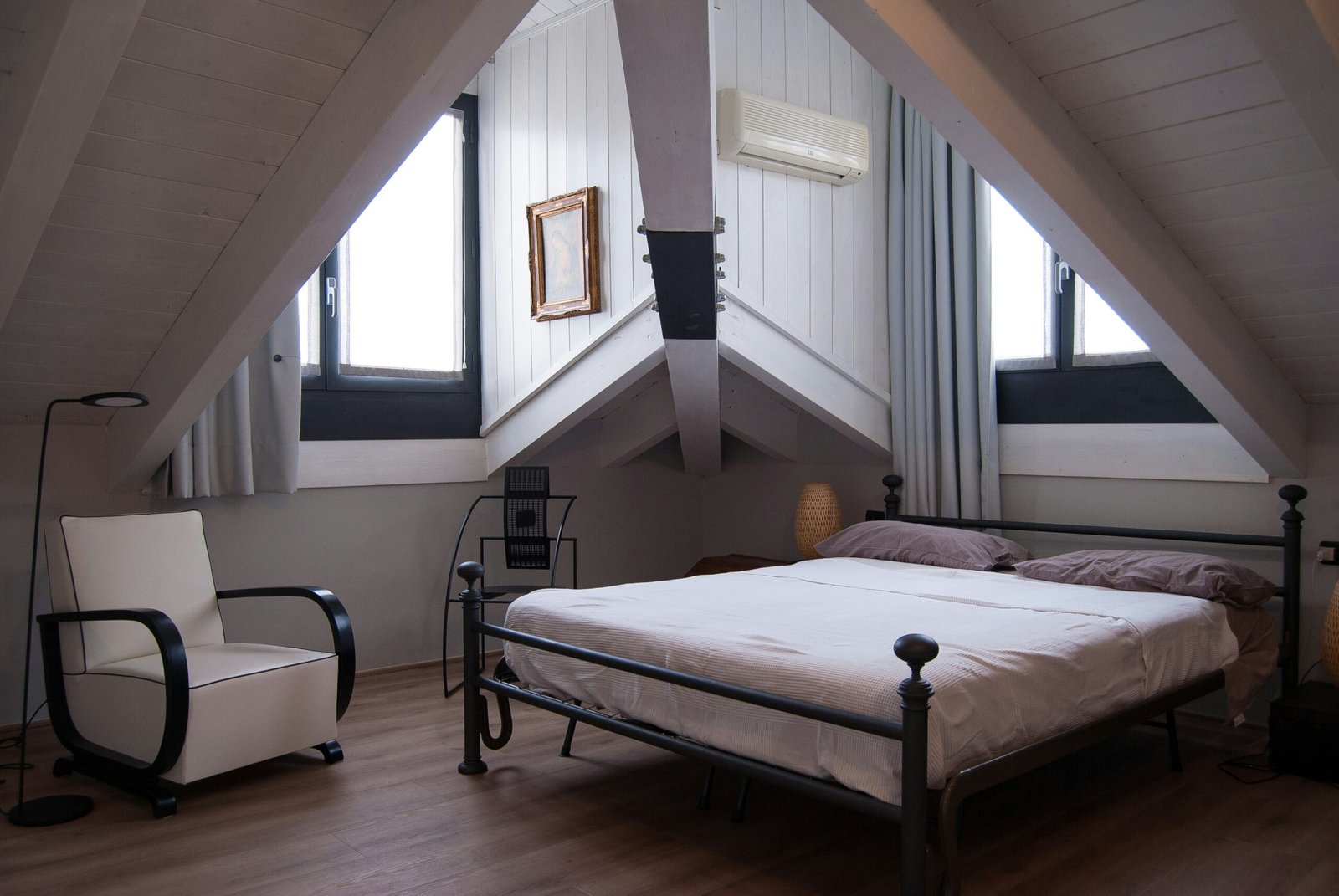 Compact guest room representing a small hospitality mattress project
